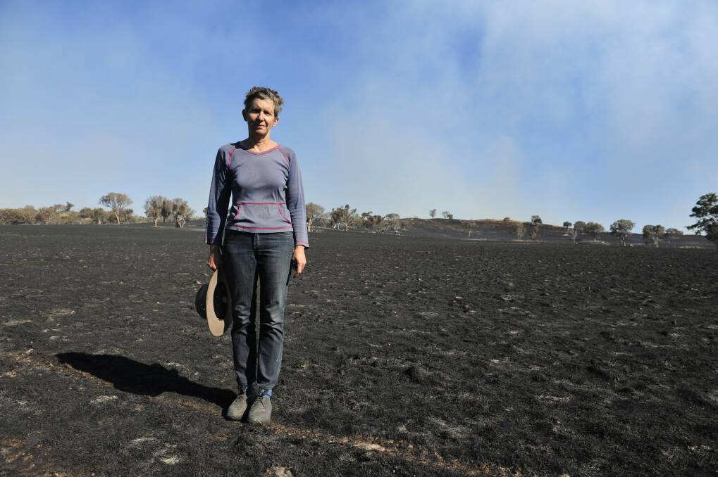 Property owner Catherine Frith stands on her property Bogolara near after she lost over 3000 livestock to the fires January 9, 2013.Photo: Jay Cronan