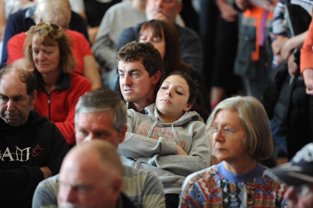 Community meeting at Snake Valley Community hall in the aftermarth of yesterdays fire in Carngham near Ballarat. Locals comfort each other at the meeting. Photo: Wayne Taylor