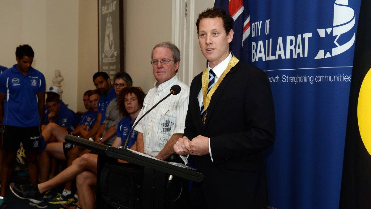 Councillor Peter Innes and Mayor Joshua Morris speak at a civic reception held to welcome the North Melbourne players and officials to Ballarat.