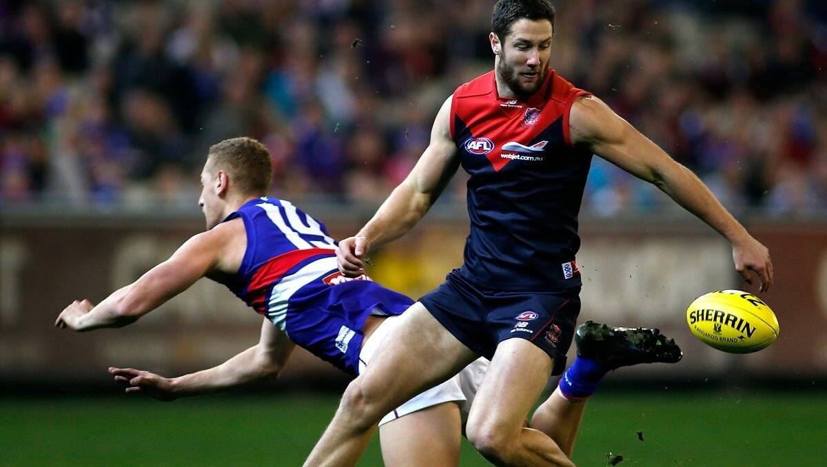  James Frawley of the Demons chases the ball during the round 14 AFL match between the Melbourne Demons and the Western Bulldogs at the MCG on June 29, 2013.