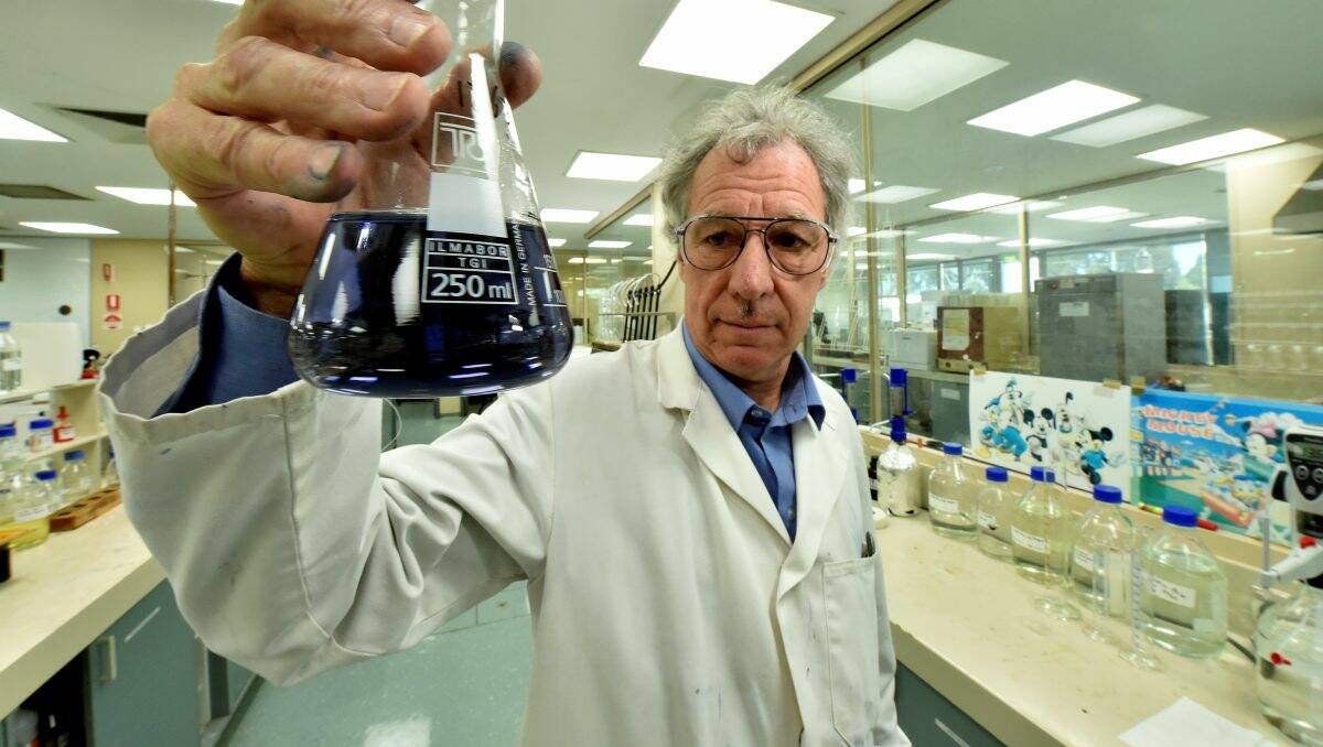 Kevin Ruddick performs a test on a water sample.