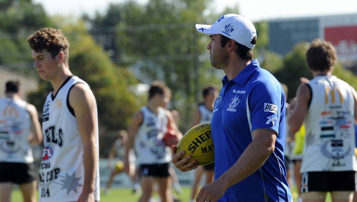 Head coach Brad Scott and assistant coaches take on masterclass training sessions with North Ballarat Rebels.