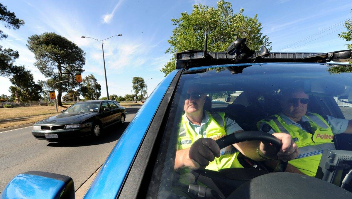  Leading Senior Constables Paul Sedgewick, left, and Geoff Holland from the State Highway Patrol use the new BlueNet vehicle to track down driving offenders and say it is “not a question of if we will catch you now but when”. PICTURE: JEREMY BANNISTER