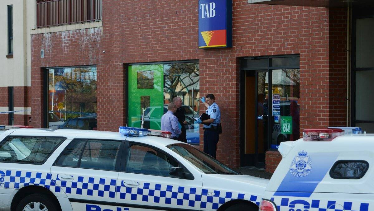 Police at a TAB outlet on Victoria Street in Ballarat after an attempted armed robbery.