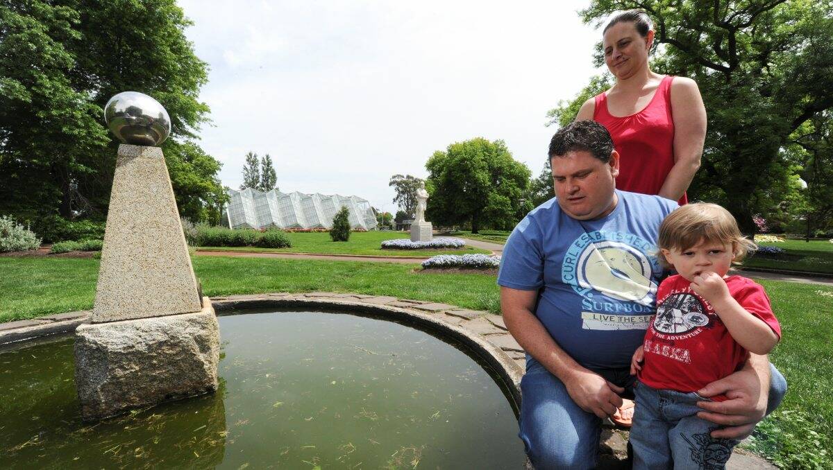Will, almost two, approached the side of the wishing well and fell face-first into the water.