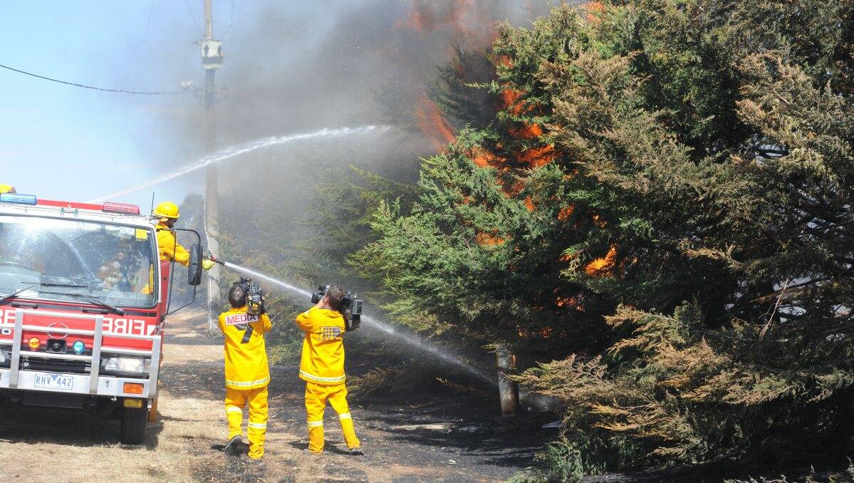 Media film crews capture firefights in action yesterday