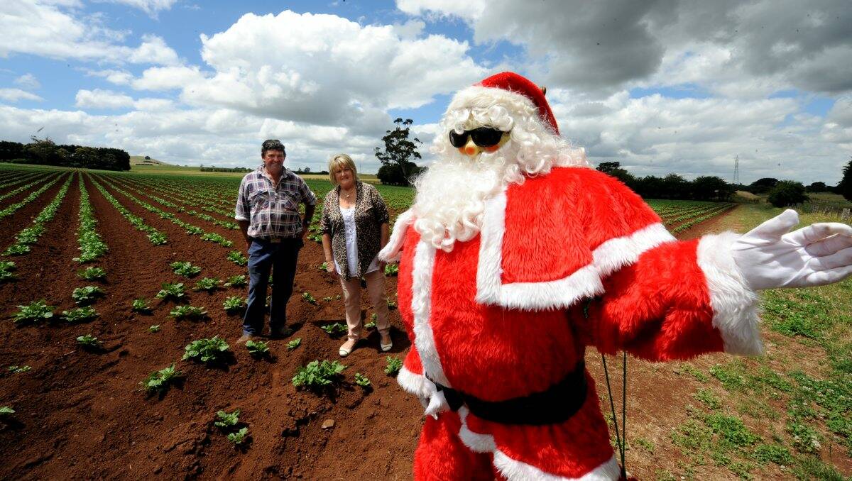 John and Cheryl Maher with their Santa on Sunday. PICTURE: JEREMY BANNISTER