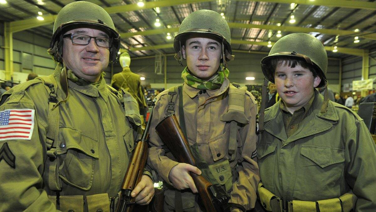 Dave Furness, Bailey Furness and Angus Johnson in army gear. Pictures: Lachlan Bence.