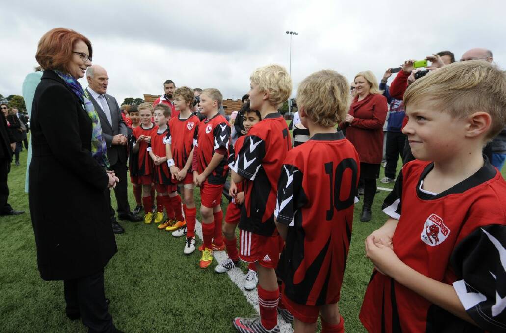 Prime Minister Julia Gillard meets some of the young players at Morshead Park on Saturday.