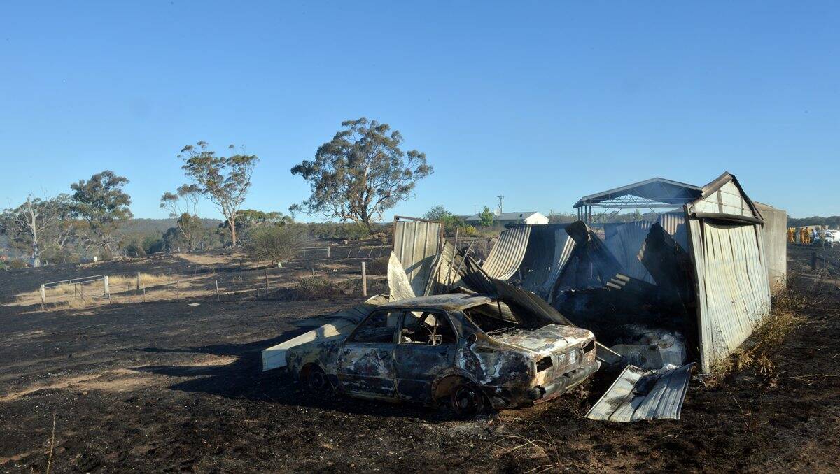 A vehicle and shed destroyed during the blaze at  Yandoit yesterday. 