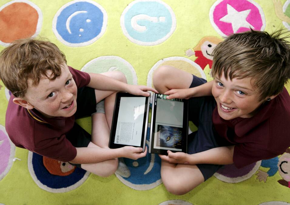 Delacombe Primary School pupils Josh Snead and Jordan Botheras read on their iPads. PICTURE: CRAIG HOLLOWAY