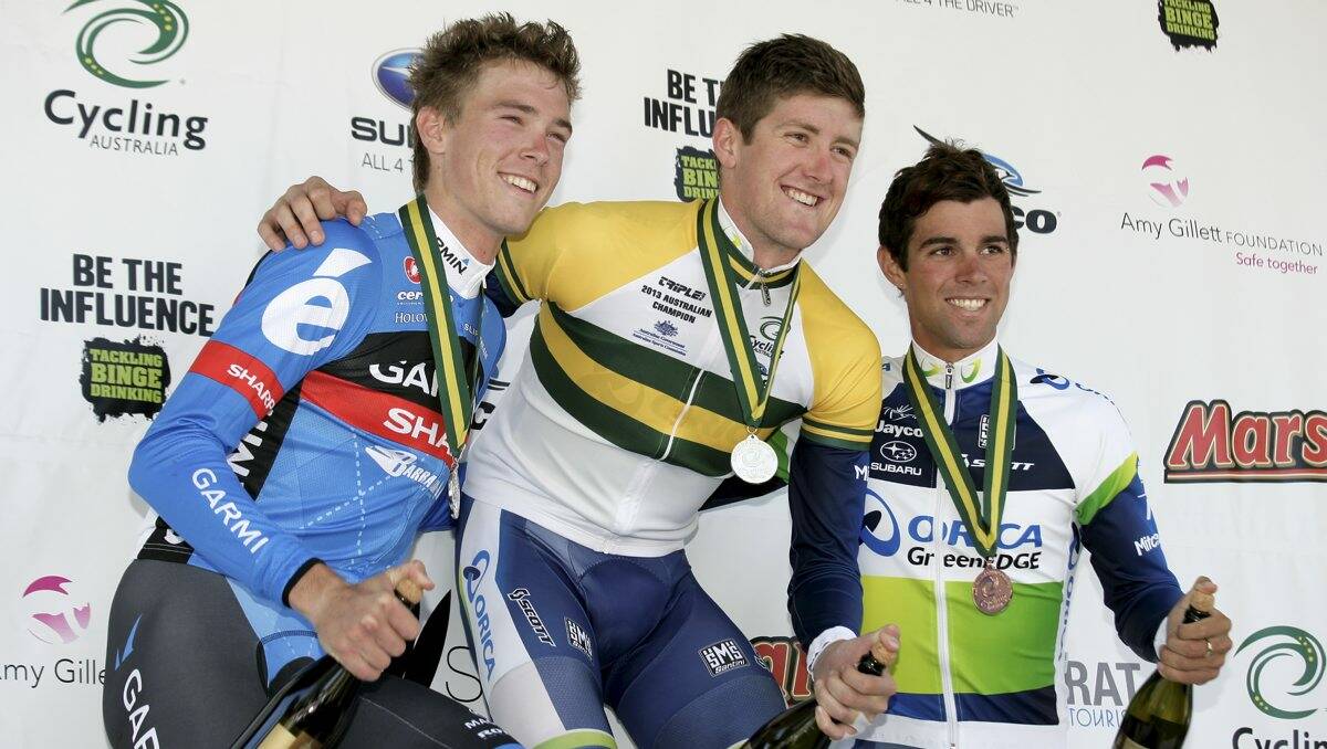 CELEBRATION TIME: Back-to-back national elite men’s time trial champion Luke Durbridge flanked by runner-up Rohan Dennis, left, and third placegetter Michael Matthews on podium. PICTURE: CRAIG HOLLOWAY