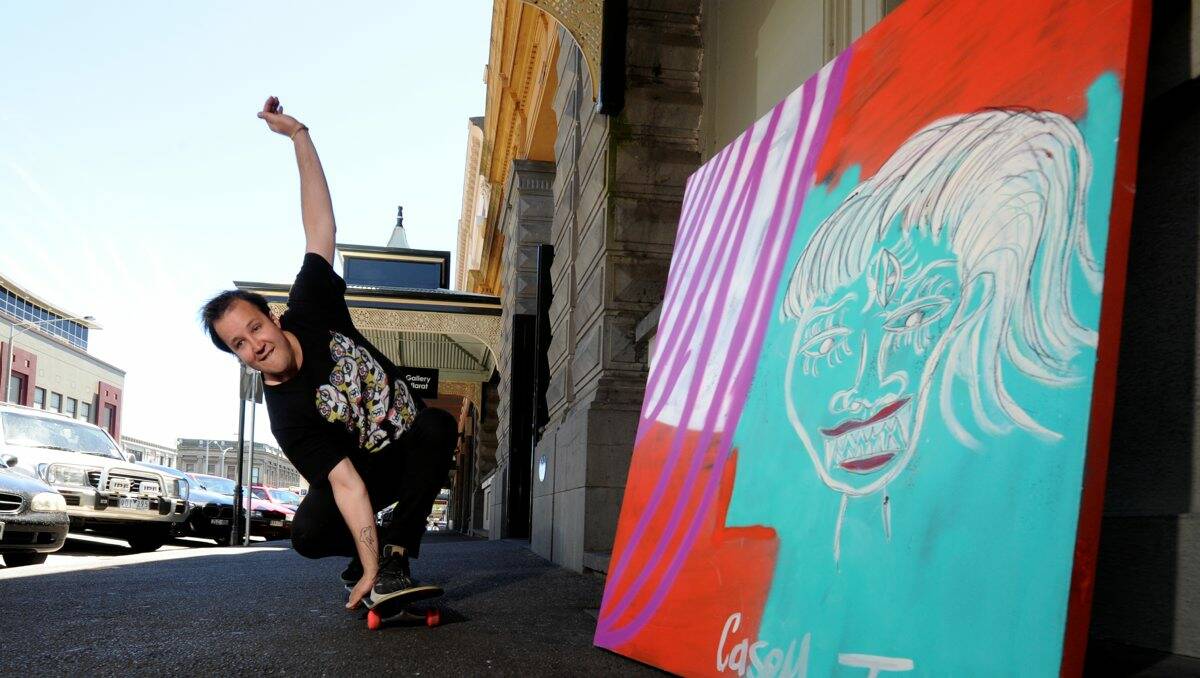  Ballarat’s Casey Tosh with one of his works, which is on show as part of his Sugar Punk Fairy exhibition. PICTURE: JEREMY BANNISTER 