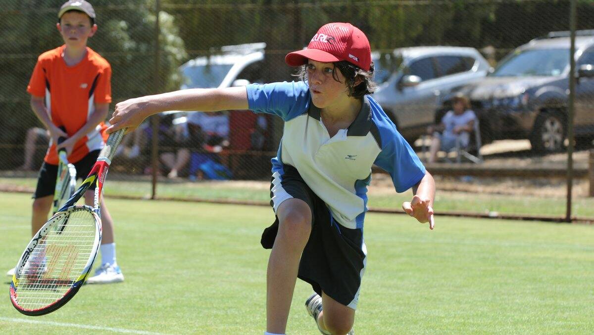Joel Bertoncello plays for Mt Prospect in the under-14 section in the opening day of the Victorian Country Tennis Association junior country week at Creswick yesterday. PICTURES: JUSTIN TRAFFORD