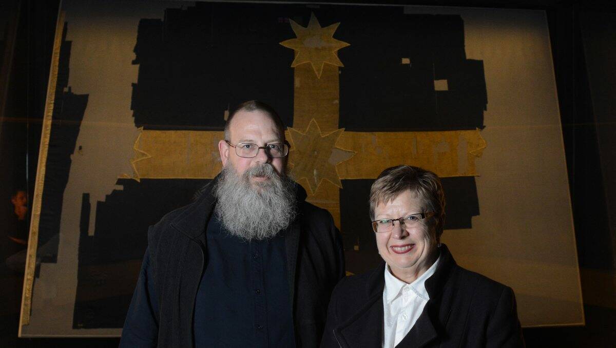  Art Gallery of Ballarat director Gordon Morrison and MADE director Jane Smith with the Eureka flag. PICTURE: ADAM TRAFFORD