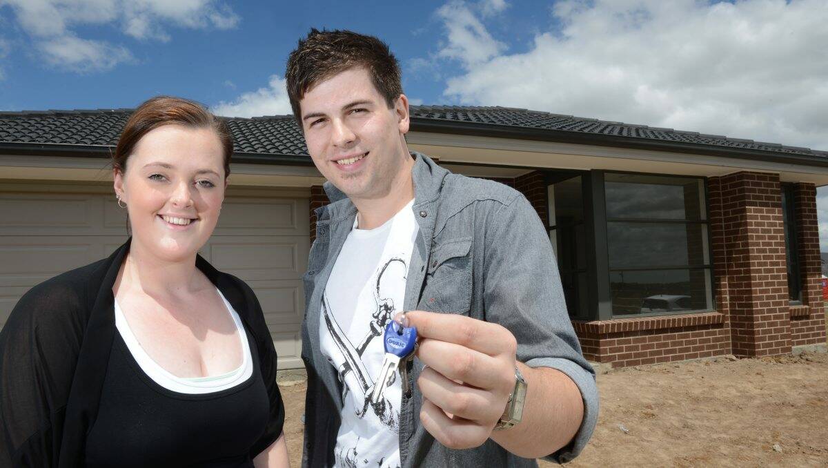 New arrivals: Jacqui Petrie and Stuart Lawrence yesterday received the keys to their property in Lucas. Ms Petrie and Mr Lawrence will be the first residents to move into Ballarat’s newest suburb. PICTURE: ADAM TRAFFORD