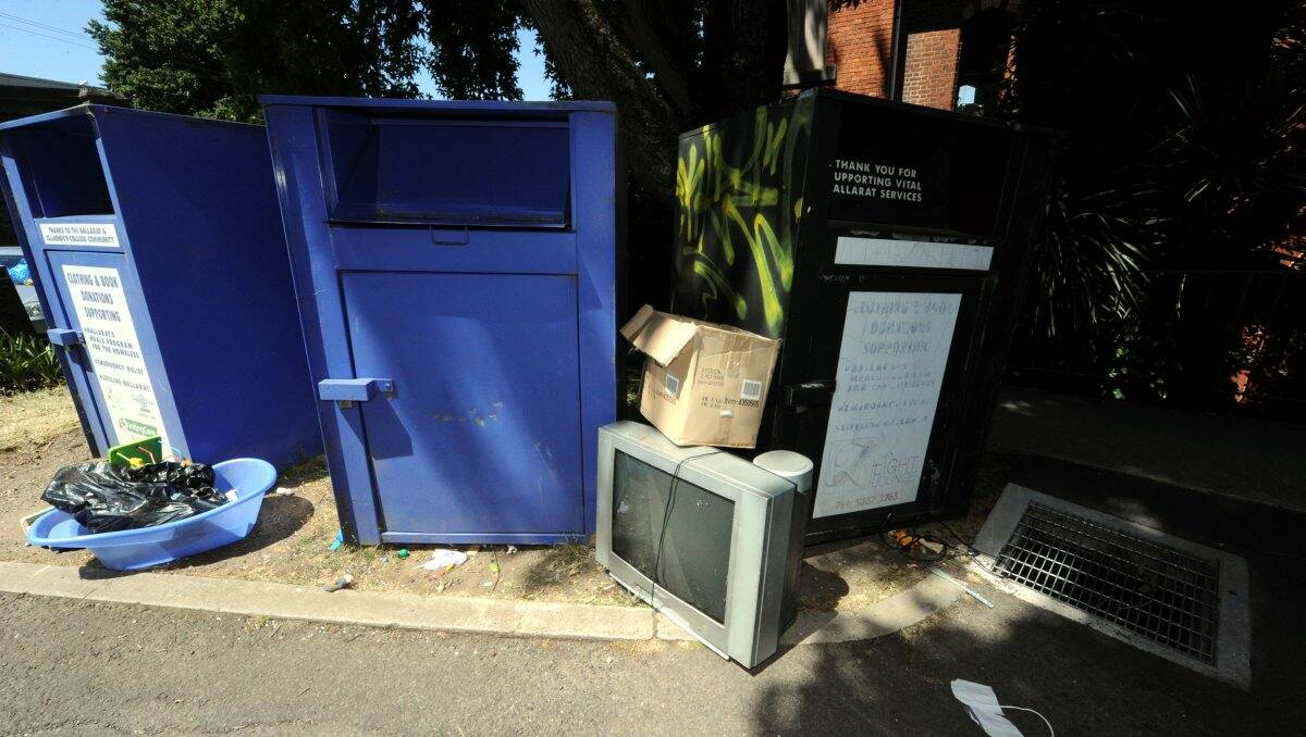 Rubbish at charity bins.