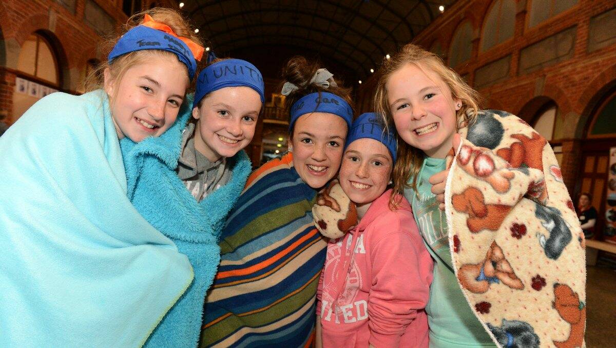 St Thomas More Primary School pupils, Maddy Scholten, 11, Ellen Simpson, 11, Bella Quinlan, 12, Georgia Collier, 11, and Remi Barbetti, 11, during the sleep out at the Mining Exchange. 