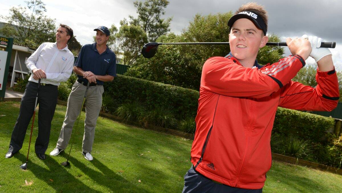 Practice hit: Midlands reigning open champion and emerging teenager Kelly Lyle at Mt Xavier for an early look at the fairways with Ballarat professional and development officer Tony Collier, centre, and Michael Cushing, of Telstra Business Plus IT. PICTURE: KATE HEALY