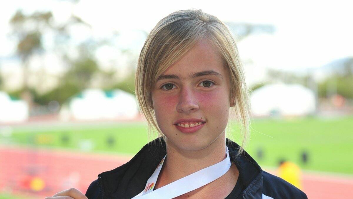 CHAMPION: Kiara Caddick proudly shows off her Australian All-Schools Track and Field Championships relay gold medal.