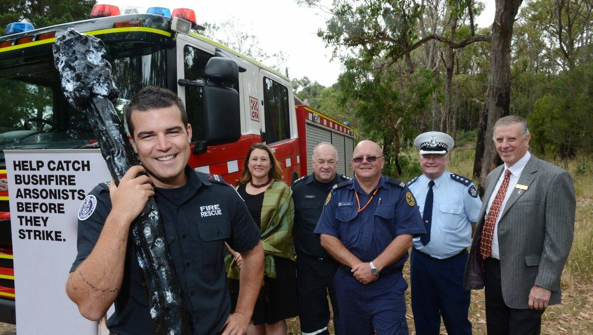 Firefighter Chris Tempest, front, with Crime Stoppers chief executive officer Samantha Hunter CFA senior station officer Mal Jones, SES volunteer support officer Jeff Webb, Inspector Greg Payne and councillor John Philips. PICTURE: ADAM TRAFFORD