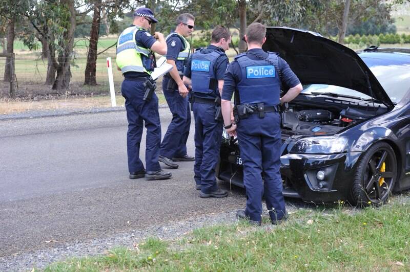 Police assess the vehicle involved in this afternoon's pursuit near Ballarat. Picture: Lachlan Bence