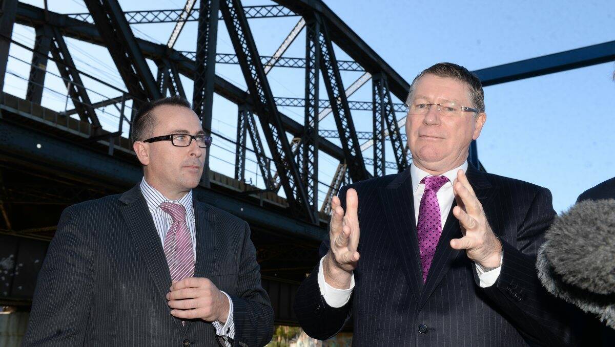 INVESTMENT: Regional Rail Link chief executive officer Corey Hannett and Premier Denis Napthine talk about the project during yesterday’s tour of the works. PICTURE: KATE HEALY