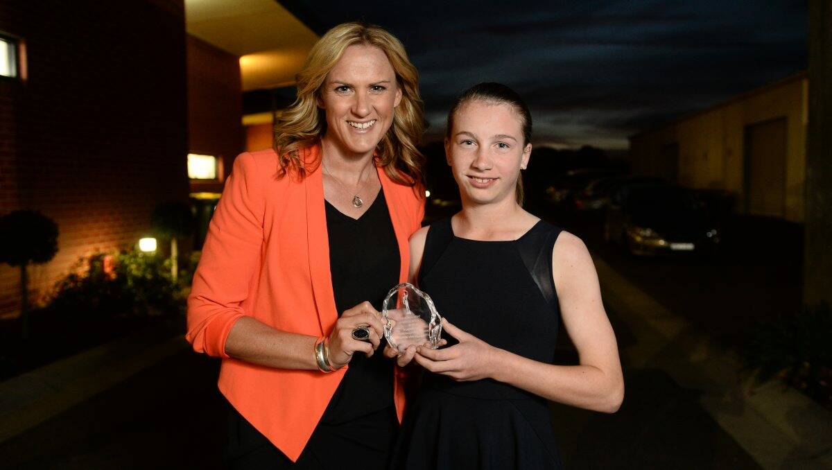 PROMISING: Young cricketer Sophie Van De Heuvel and Australian netballer Sheryl McMahon, who presented the Blackbourn Encouragement Award trophy. 