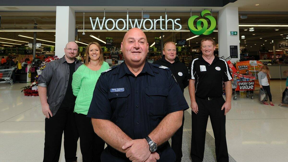 STRONG TEAM: TLC for Kids chief executive officer Tim Conolan, Support 4 Cancer’s Colleen Thompson, Sergeant Dave Collins and Shane Darroch and Michael Colville from Woolworths.  picture: JUSTIN WHITELOCK